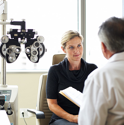 A woman conversing with her optometrist